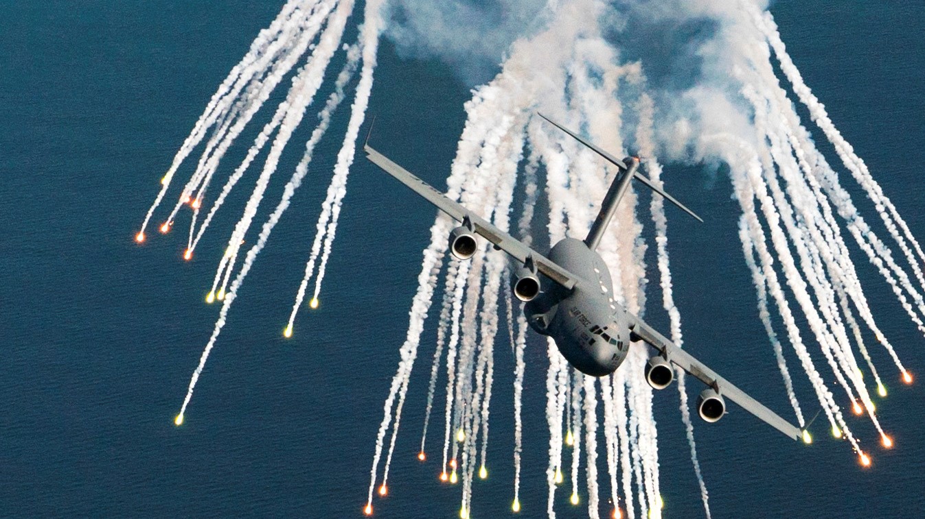 C-17 releasing flares in flight